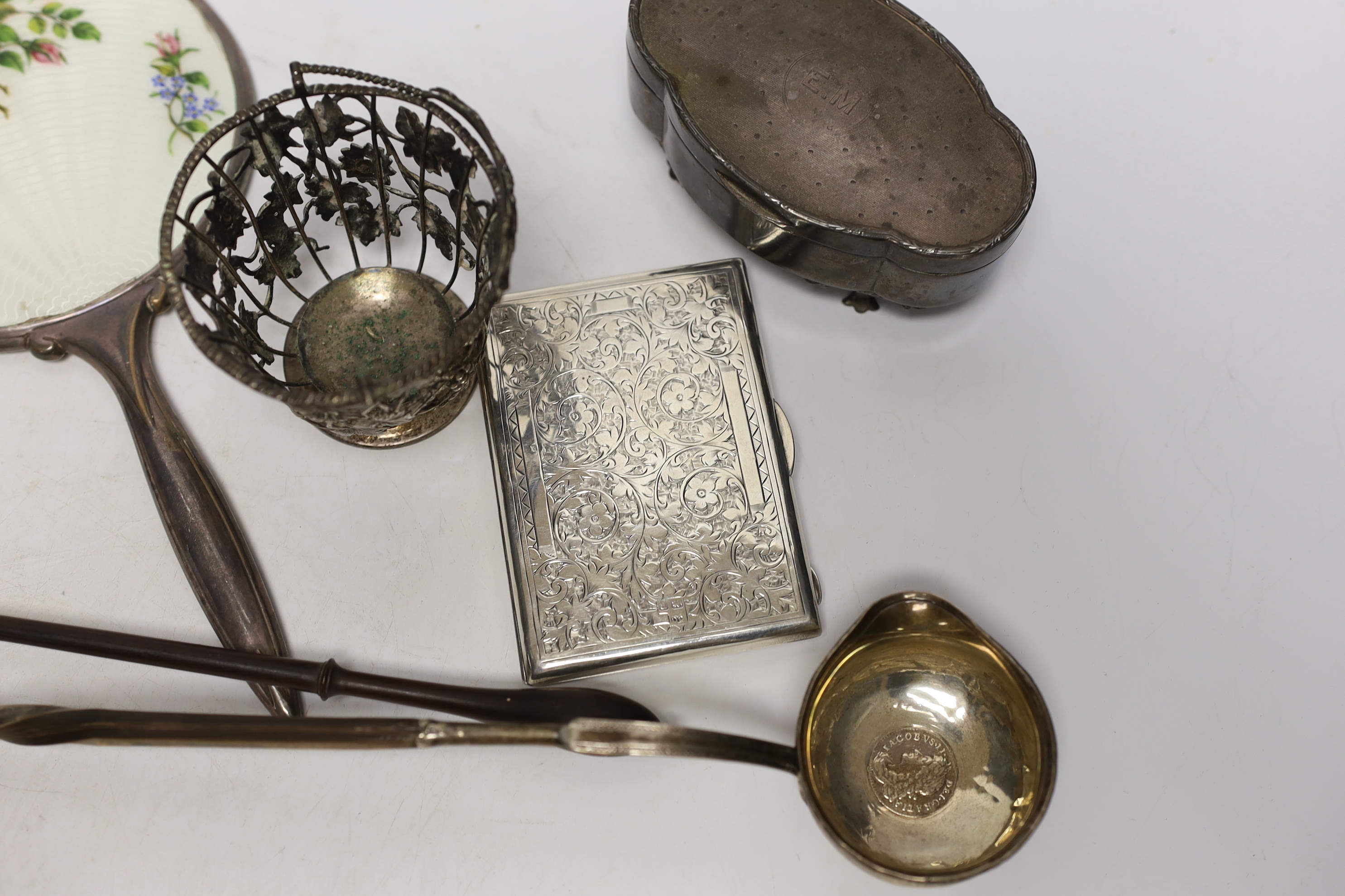 A group of assorted silver and white metal items including a George V trinket box, cigarette case, sterling stamp box, Dutch matchbox holder, George V sugar basket by William Comyns (no liner), two toddy ladles and two o